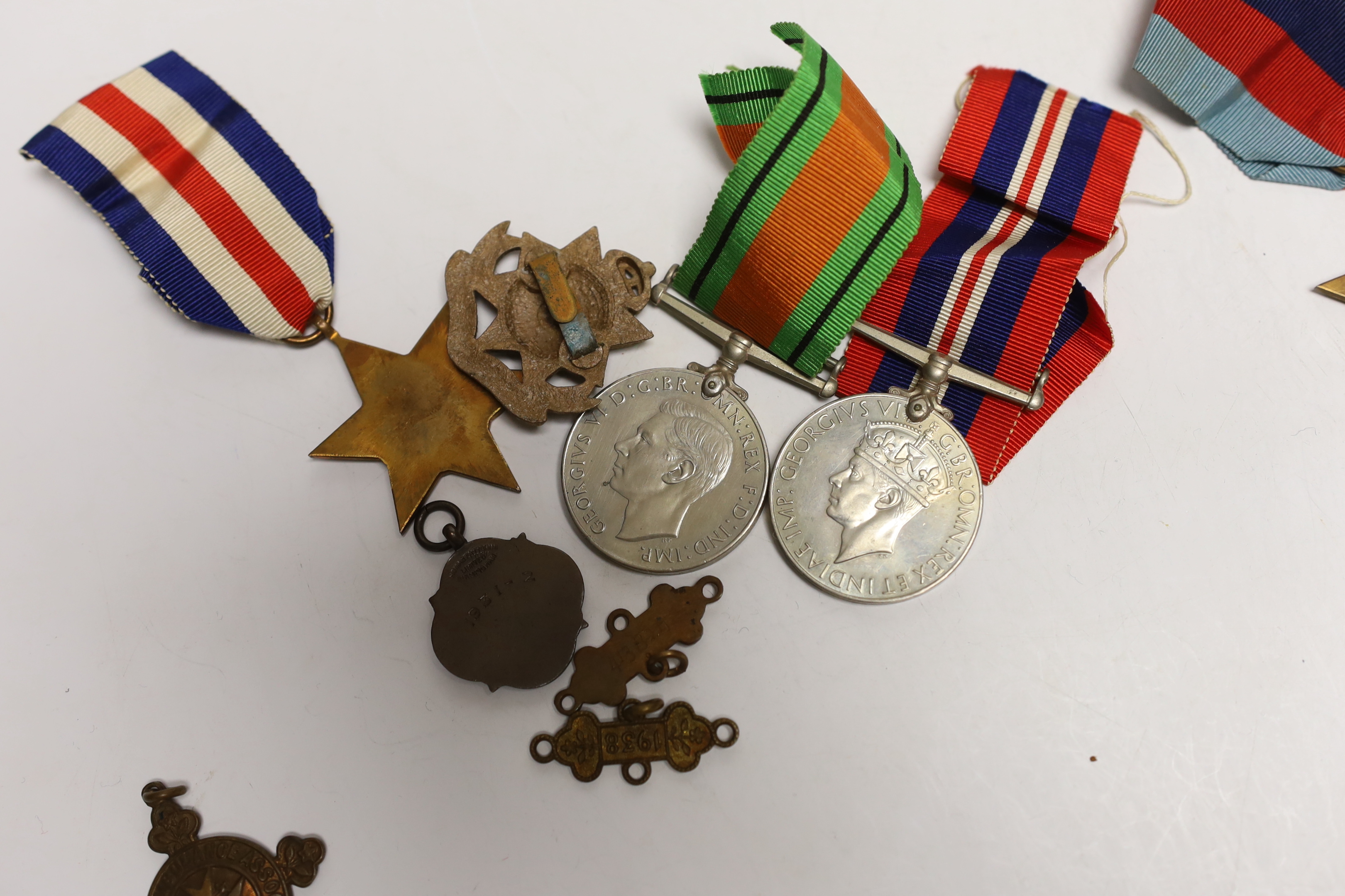 Four WW2 medals- the Defence Medal, the War medal, the 1939-1945 Star and the France & Germany Star and other minor items.